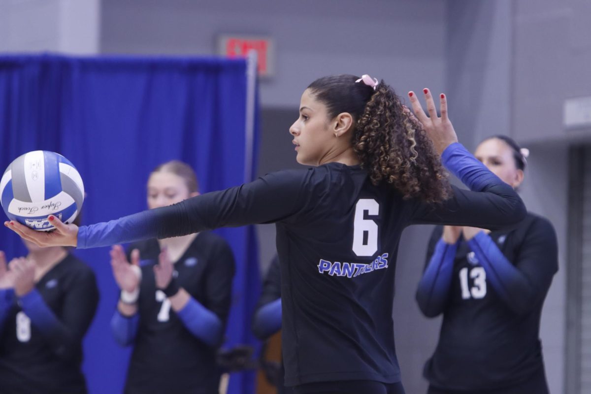 Destiny Walker (6) ready's up her serve towards the Tennessee Tech this evening in the Lantz Arena