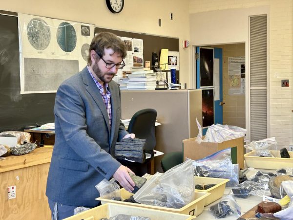 Jake Crandall moving analog samples in the lab located in the Physical Sciences building at Eastern Illinois University on Oct 4, 2024.