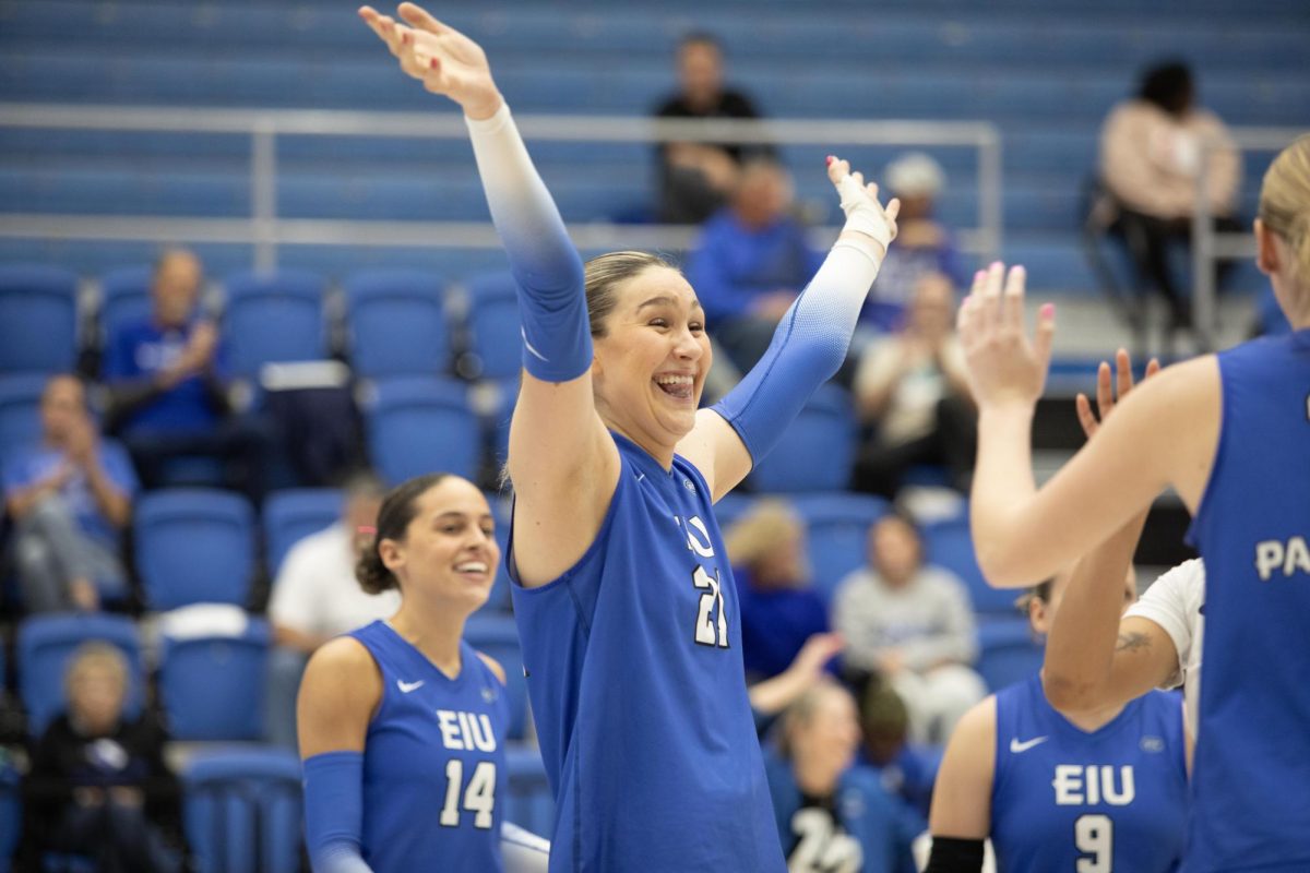 Middle blocker Graduate student Ireland Hieb cheers with her team when they scored during the second set at the Eastern Illinois University game against Southern Illinois University Evansville, on Tuesday Oct 15. 2024.