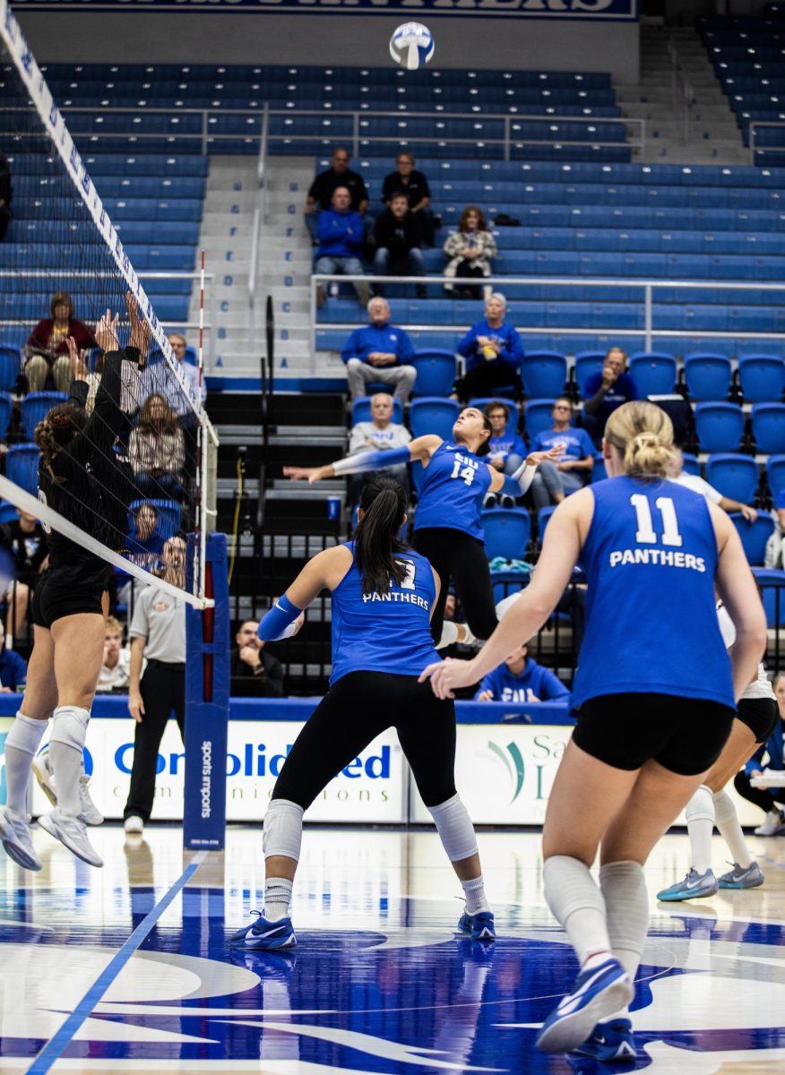 Junior Outside hitter Lilli Amettis spikes the ball over the next winning another point for Eastern Illionis University, during the Eastern Illinois University against Southern Illinois University Evansville, on Tuesday 