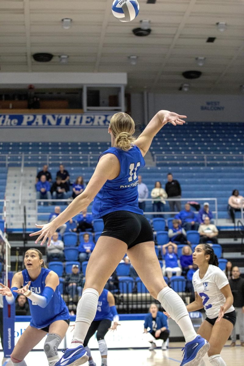 Senior Outside Hitter Kaitlyn Flynn, tapes the ball over the net during the Eastern Illinois University against Southern Illinois University Evansville, on Tuesday Oct 15. 2024. at Groniger Arena on the Eastern Illinois University campus.