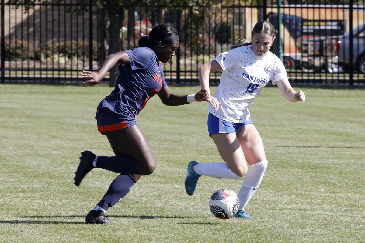 Senior defender Morgan Rinker (18) prevents senior forward Nyeemah Prescod-Beckles (21) from advancing during the women's soccer game against the UT Martin Skyhawks Sunday at Lakeside Field. Prescod-Beckles had two shots and one shot on goal. The Panthers lost 1-0 against the Skyhawks. 