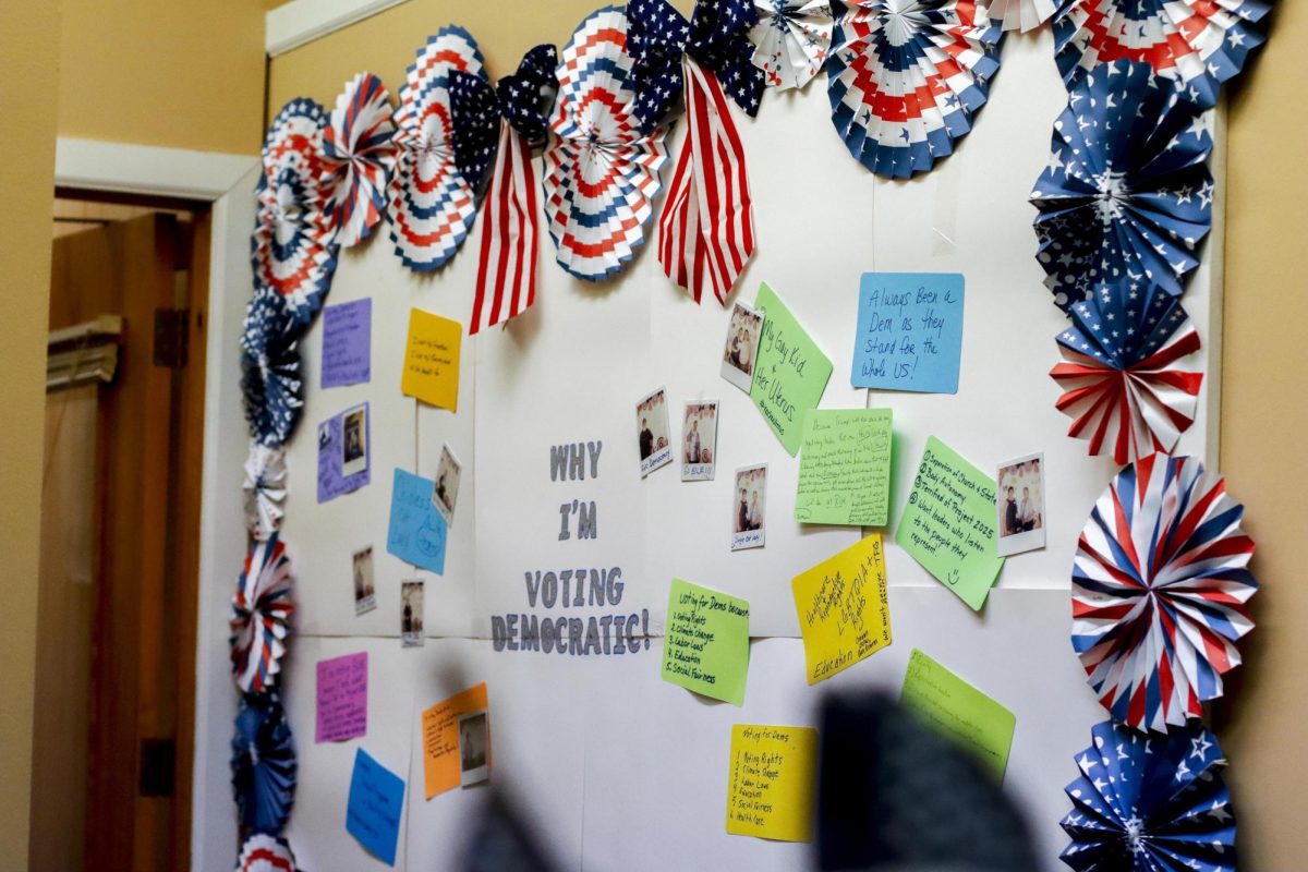 A sign inside the Coles County Democratic Party headquarters depicts the reasons why people chose to vote democratic during the watch party of the 2024 election Tuesday evening.