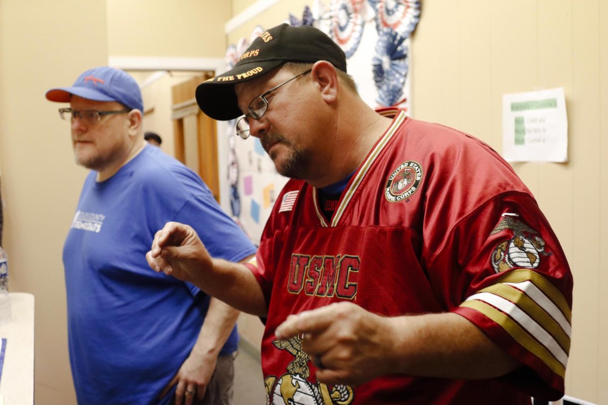 Doug Fagan does a little celebration dance as the county board results roll in at the Coles County Democratic Party headquarters before finding out he lost on Tuesday evening.