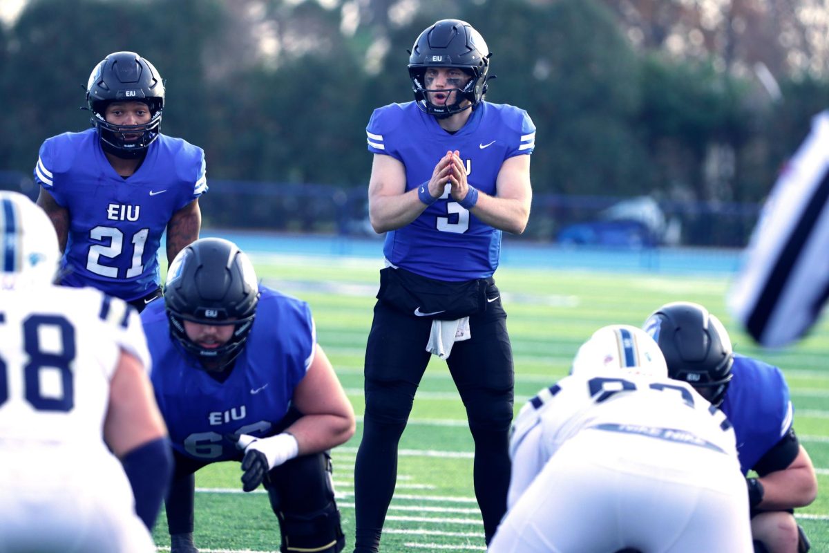 Eastern graduate quarterback Pierce Holley (3) and redshirt sophomore Jay Pearson (21) line up behind the line before the snap during the football game against Charleston Southern University Saturday at O'Brien Stadium. The Panthers won 16-13.