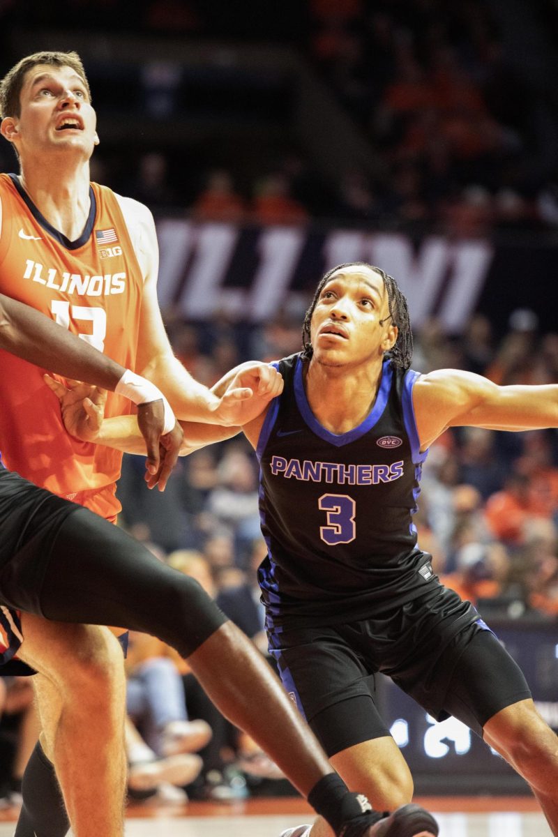 Senior guard NaKyel Shelton guards the University of Illinois from the ball during the exhibition game Monday.