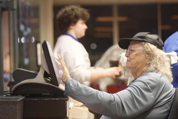 Mary Kaiser clears the checkout screen after a student gets their meal on Monday at Stevenson Tower Deli.