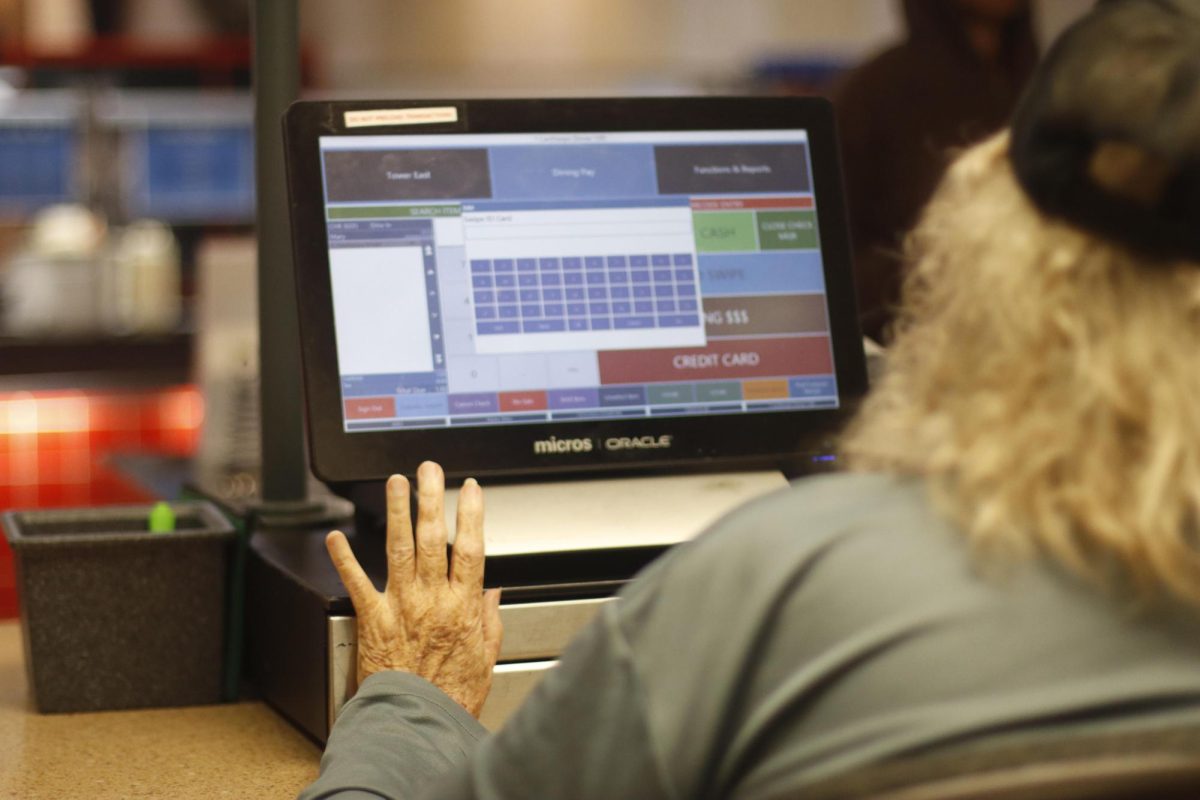 Mary Kaiser rings up students at the register in Stevenson Hall.