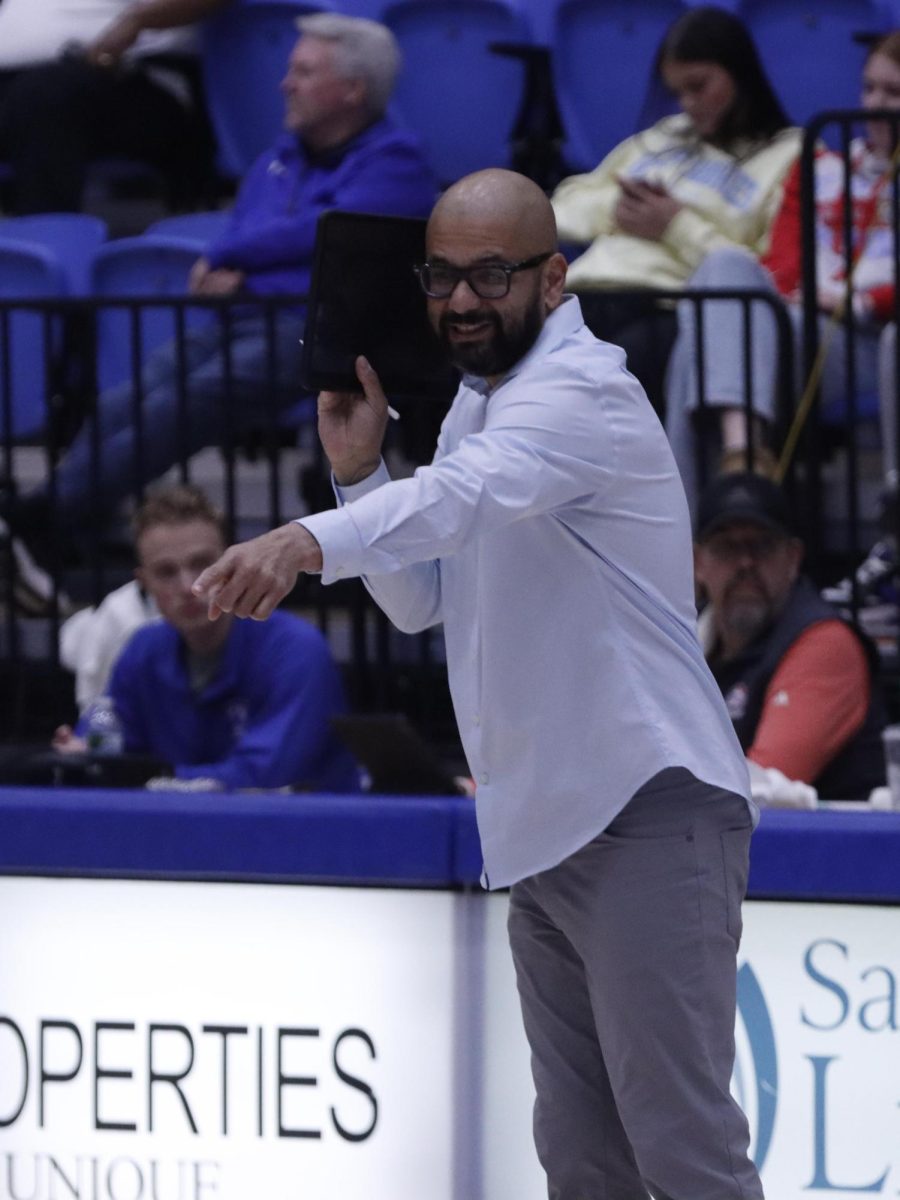 Associate Head Coach Manolo Concepcion talks to the Volleyball team from the side lines during the game against Tennessee  State at the Groniger Arena on the Eastern Illinois University campus, Nov 20,2024. Charleston ILL. 