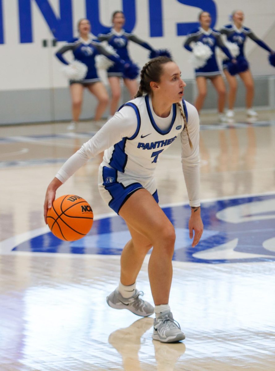 Senior guard Kiyley Flowers dribbles during the Eastern Illinois University women's basketball game against Indiana State Sycamores at Groniger Arena in Charleston, Ill., Friday, Dec. 6 2024.