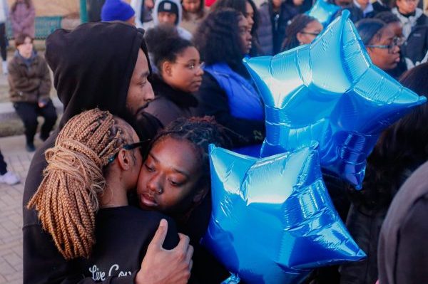 Students hug at the candlelight vigil for Eastern student Yahacov Dennis who died last Saturday, January 25 at Amoco. 