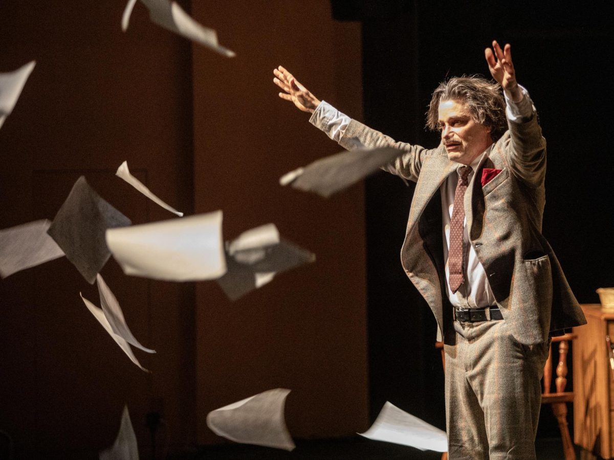 Jack Fry, a solo performer, plays as Albert Einstein in his one man show "Einstein!" and throws his theories into the audience after being debunked at The Theatre in the Doudna Fine Arts Center Friday evening.