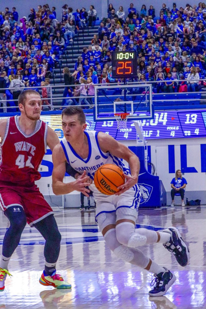 Eastern graduate forward Kooper Jacobi drives into the paint against senior forward Hrvoje Majcunic of Calumet College of St. Joseph during Eastern’s win 87-57 at the Kid’s Day Game on Friday 