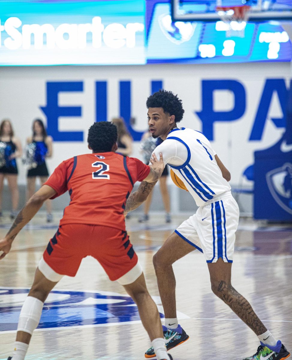 Senior guard Corey Sawyer Jr trying to get around junior guard Jayland Randall at the three-point line during the second half of Eastern’s lost to Southern Indiana 64-60 on Saturday. 