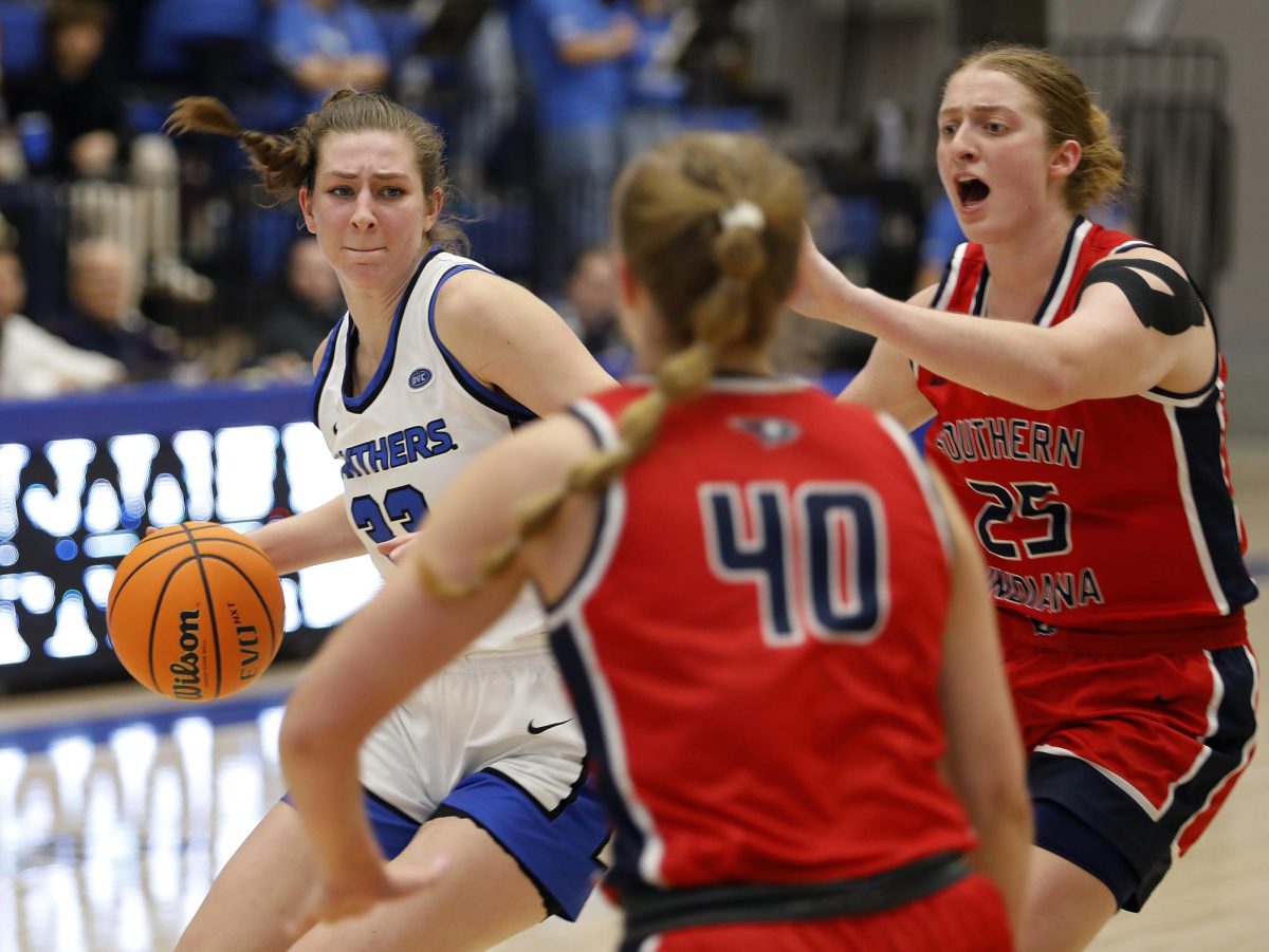 EIUsenior forward Macy McGlone (33) pushes for ground toward the basket during the women's basketball game against University of Southern Indiana at Groniger Arena Saturday. McGlone fouled out in last quarter and led the Panthers with 22 points and 16 rebounds. The Panthers won 51-49 in a late game layup and free throw with 13 seconds left allowing the Panthers to continue on a 10-0 win streak in the Ohio Valley Conference.  