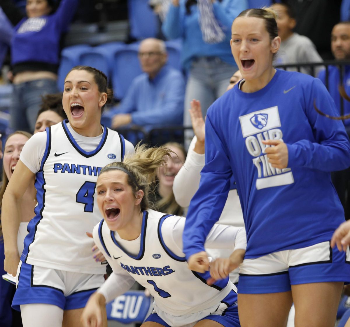 EIU players (from left) Lyric Johnson (4), Ella Lune (1) and Jayda Johnston cheer after a late-game layup putting the Panthers in the lead by one point with 15 seconds left in the game. against the University of Southern Indiana at Groniger Arena Saturday.