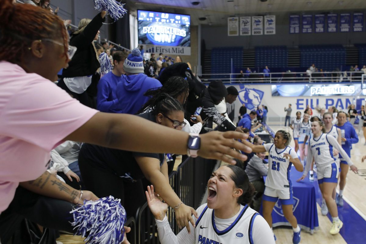 Members of the EIU women's basketball game rush to the student section to celebrate a 51-49 win over the University of Southern Indiana Groniger Arena Saturday. The Panthers won 51-49 in a late game layup and free throw with 13 seconds left allowing the Panthers to continue on a 10-0 win streak in the Ohio Valley Conference.  