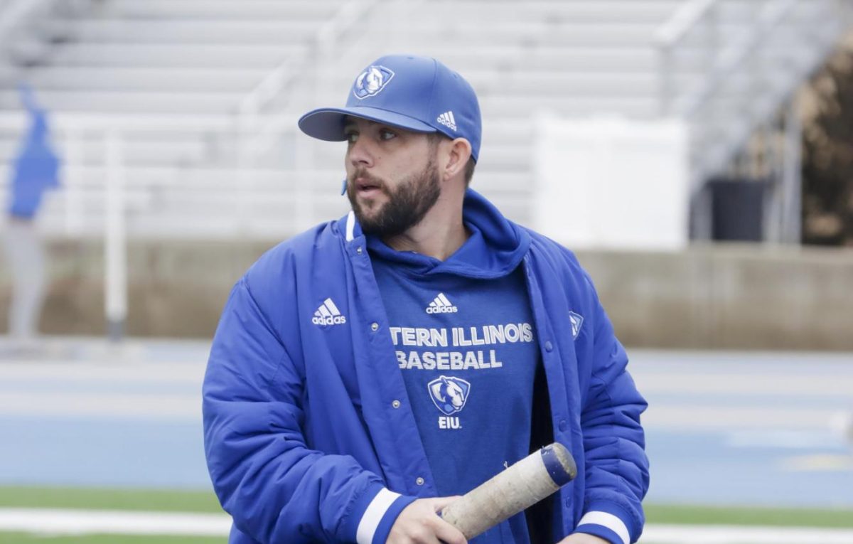 (Thumbnail Edition) The Eastern Illinois University baseball hitting coach, Mike Pugliese, taking the team through its pregame routine before the first intrasquad scrimmage of the season at O'Brien Field on Jan. 31. in Charleston, Illinois