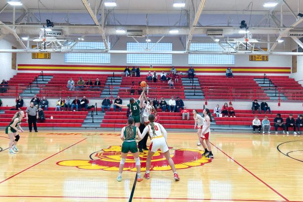 Charleston High School girls' basketball begins its regional quarterfinal as the ball is tipped for the play-in game against Mattoon on Saturday