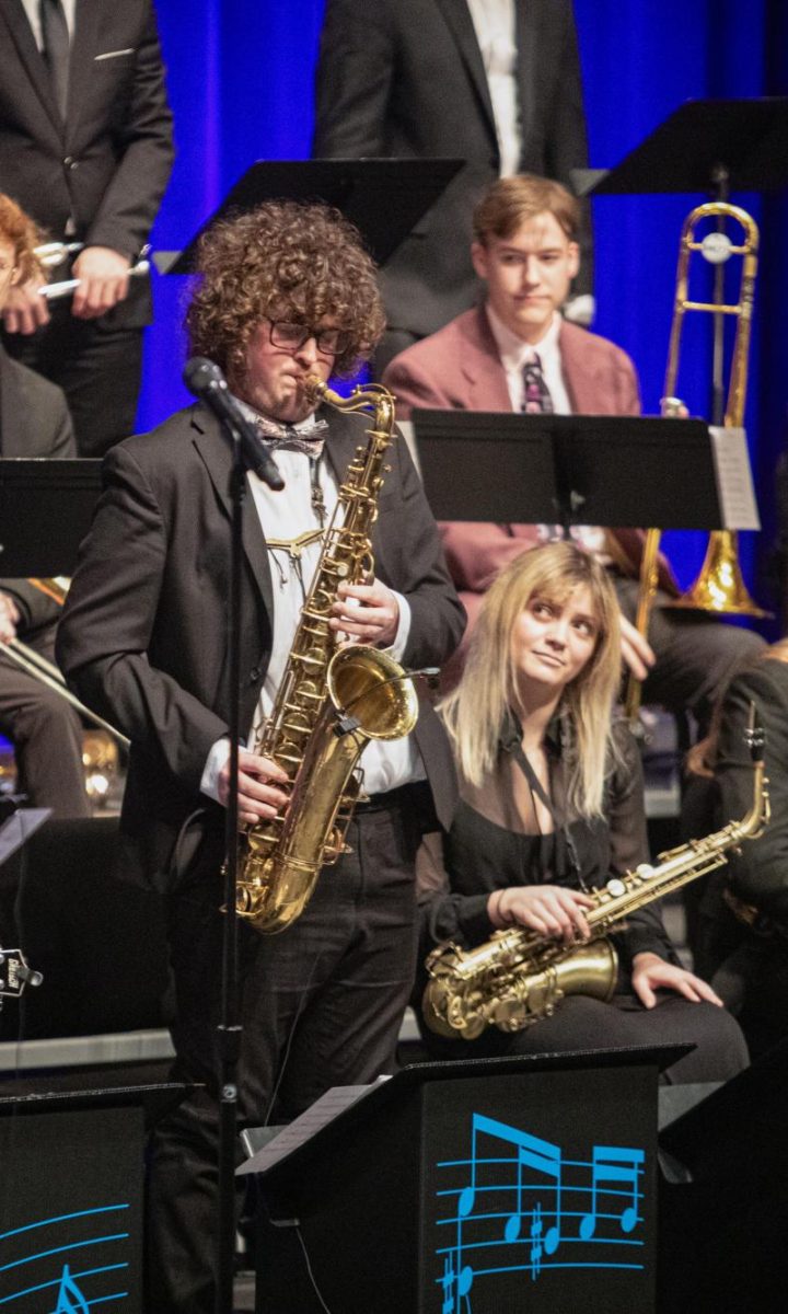 Tenor saxophonist Noah Captain performs a solo on a jazz chart during the first performance Friday.