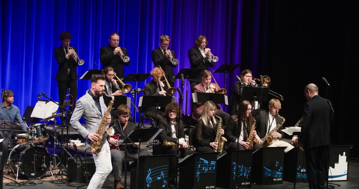 Saxophonist Chad LB solos on a jazz chart with the Eastern Illinois Jazz Ensemble during the first song of Eastern Jazz Festival.