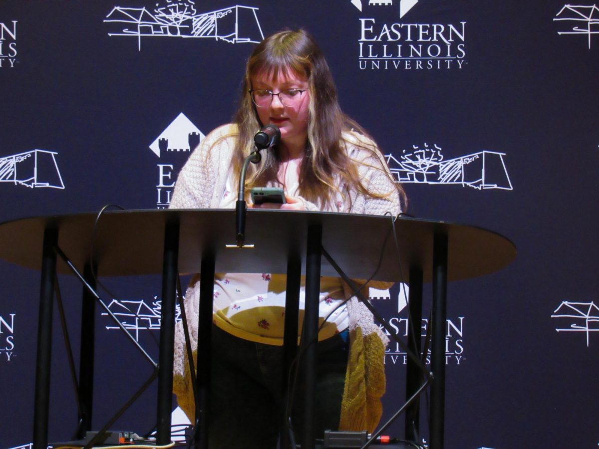 Graduate student Jenna Tobias reads her creative nonfiction work at the Lions in Winter Festival in the Dvorak Concert Hall on Thursday