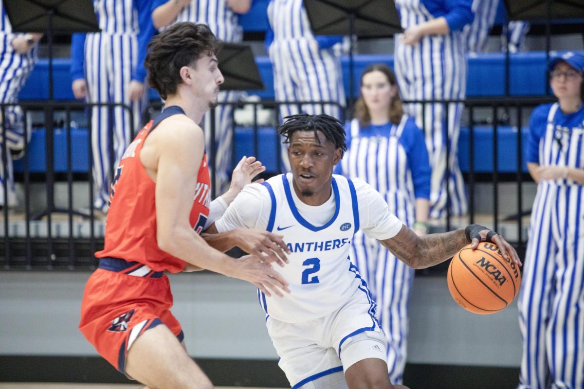 Graduate student guard Artese Stapleton drives to the basket against UT Martin in the first half during Eastern’s loss to UT Martin 72-68 on Saturday.