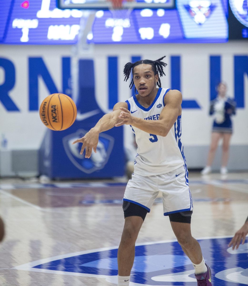 Senior guard Nakyel Shelton passes the ball around the perimeter looking for an open shot during Eastern’s loss to UT Martin 72-68 on Saturday.