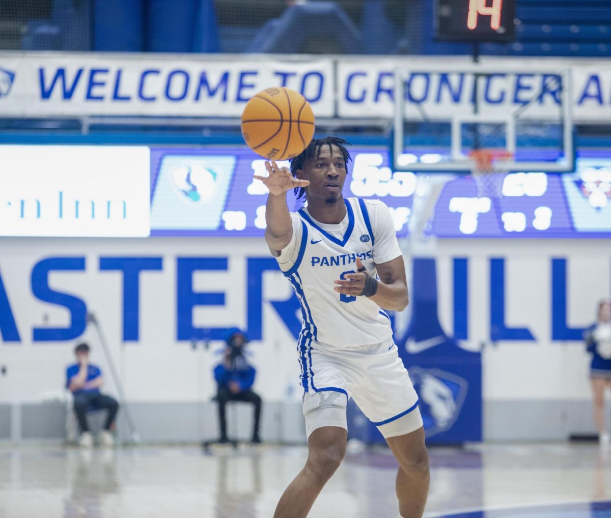 Graduate student guard Artese Stapleton passes the ball around the perimeter in the first half during Eastern’s loss to UT Martin 72-68 on Saturday.