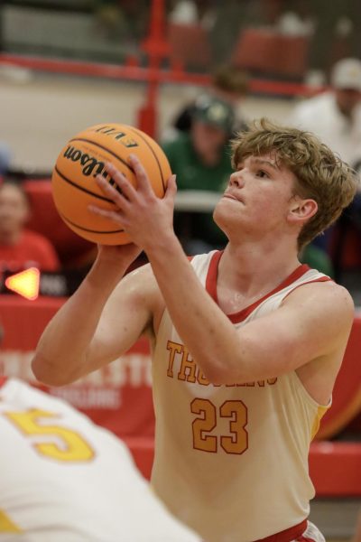 Junior guard Tyler Oakley shoots a free throw during Charleston High School boys' basketball game against Mattoon High School that Mattoon won 52-43 on Feb 1 at Baker Gym in Charleston, Illinois