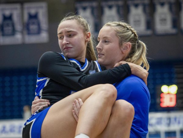 Fifth year, forward Jayda Johnston carries senior guard Kiyley Flowers off the court during the first quarter of the game against Tennessee State Tigers in Groniger Arena on the Eastern Illinois University on Feb. 13. 