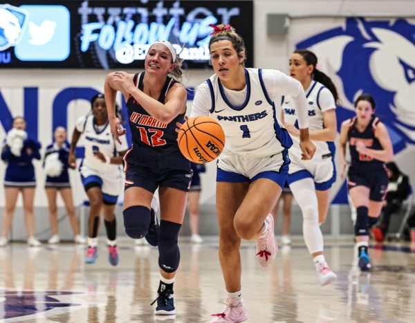 EIU redshirt forward Ella Lune steals a ball from UT Martin senior forward Abby Stephens during the women's basketball team Saturday at Groniger Arena.