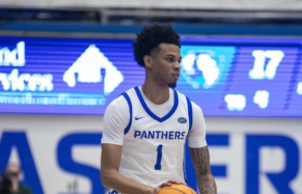 [Thumbnail Edition] Eastern senior guard Corey Sawyer Jr bringing the ball up past the half court line during the first half Eastern’s win against Little Rock 71-60 at Groniger Arena on Thursday.