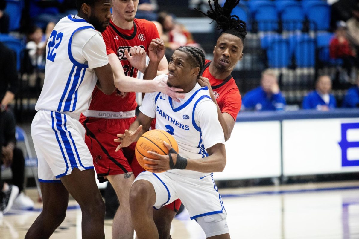 Graduate student Artese Stapleton driving to the basket through a crowded interior during Eastern’s 73-58 win over Southeast Missouri State on senior night on Saturday.