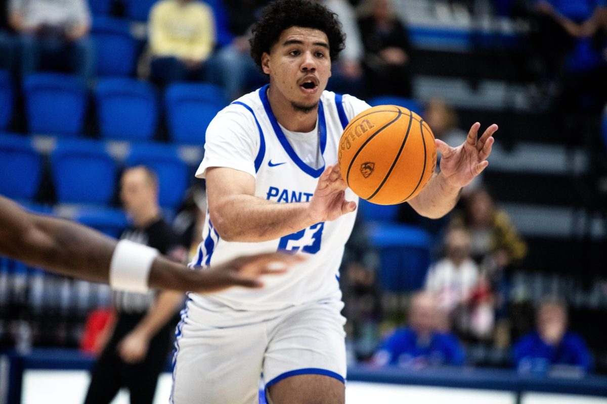 Senior forward Rodolfo Bolis passing the ball to the outer perimeter during Eastern men's basketball game’s 73-58 win over Southeast Missouri State on senior night on Saturday.