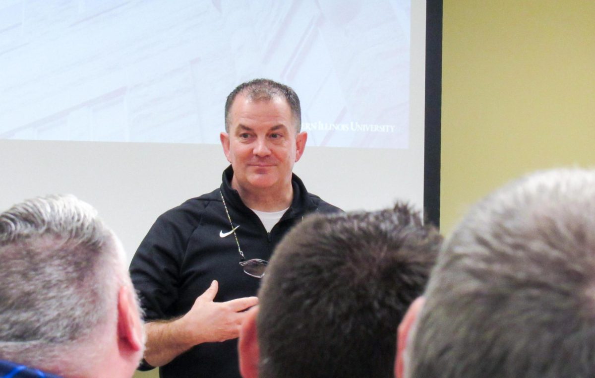 EIU President Jay Gatrell talks to members of faculty in the Witter's conference room on Friday.