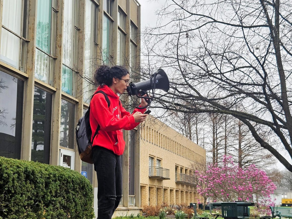 Jason Farias history education major, leads the SFS protest Saturday. The protest was held against a Coles County Republican Party fundraiser that was held in the Grand Ballroom of the Martin Luther King Jr University Union.