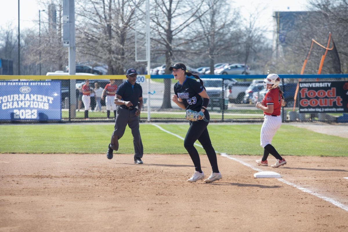 Eastern Illinois University softball freshman utility player Abbi Hatton celebrating the out at first base as the inning is over at Williams Field during Eastern’s first game against Southeast Missouri State as Eastern split the games as Eastern lost the first game 3-0 and won the second 8-5 on Friday.