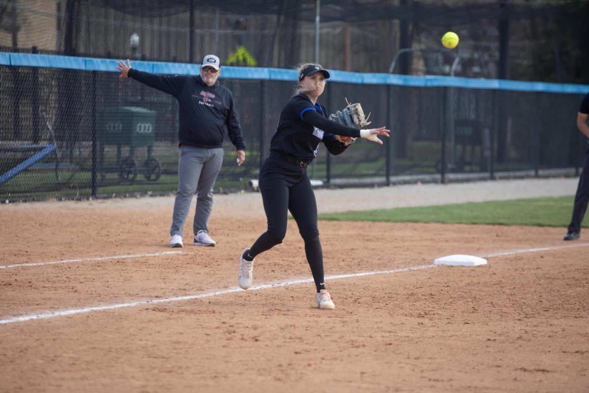 Eastern Illinois University softball junior infielder Kendall Grover throwing the ball to first base for the out at Williams Field during Eastern’s first game against Southeast Missouri State as Eastern split the games as Eastern lost the first game 3-0 and won the second 8-5 on Friday.