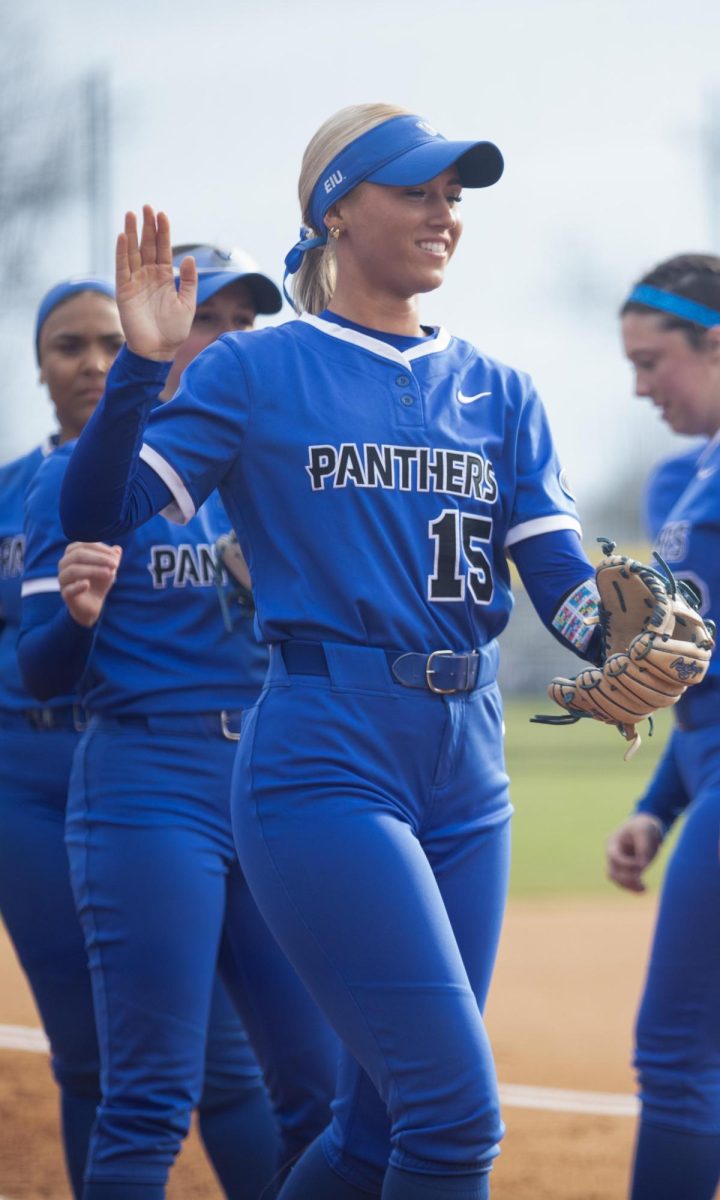 Eastern Illinois softball junior infielder Mia Mazzola getting ready to hug her teammate after her name was called on the starting lineup at Williams field as Eastern lost to Washington 3-2 in eight innings on Thursday.