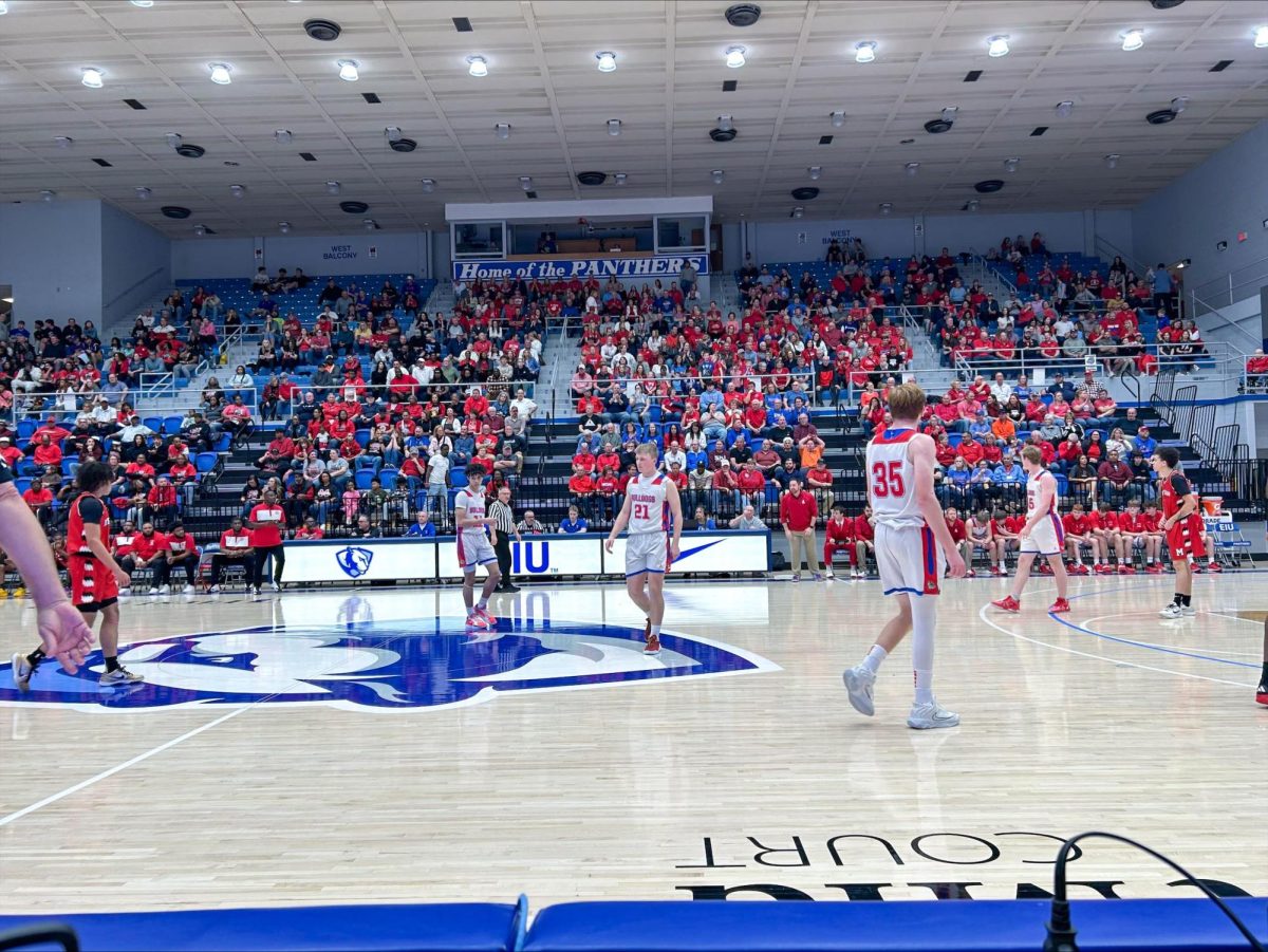 Players walk across the court during the Illinois High School Association Class 1A Super sectional game between Meridian High School and St. Anthony High School at Groniger Arena on Monday.