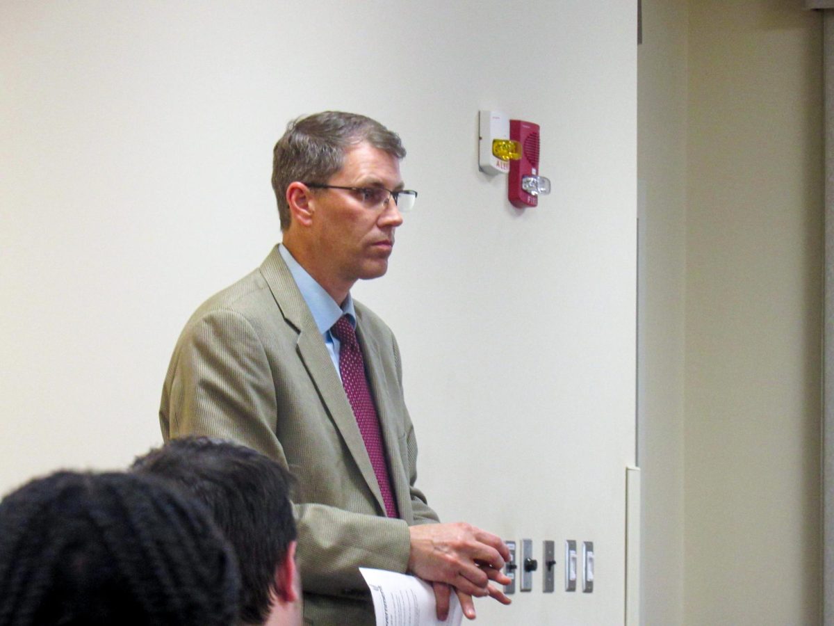 Vice President for Business Affairs Matt Bierman discusses updated fees for the 2025-26 school year with the EIU student senate at its weekly meeting in the 1895 room of the Martin Luther King Jr student union on Wednesday.