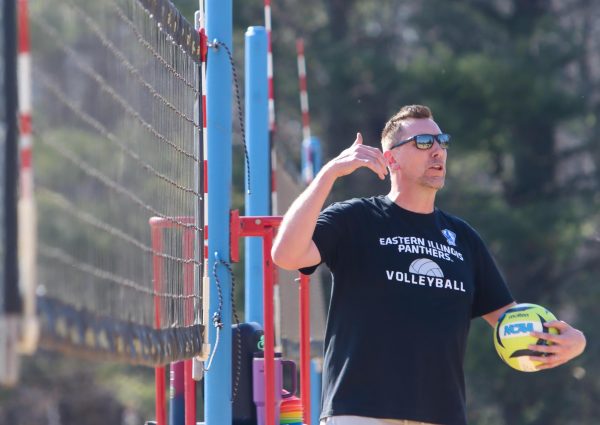 Eastern Illinois University’s volleyball coach Ryan Millar gives directions to his players at the Sister City Park Beach Volleyball courts on March 13.