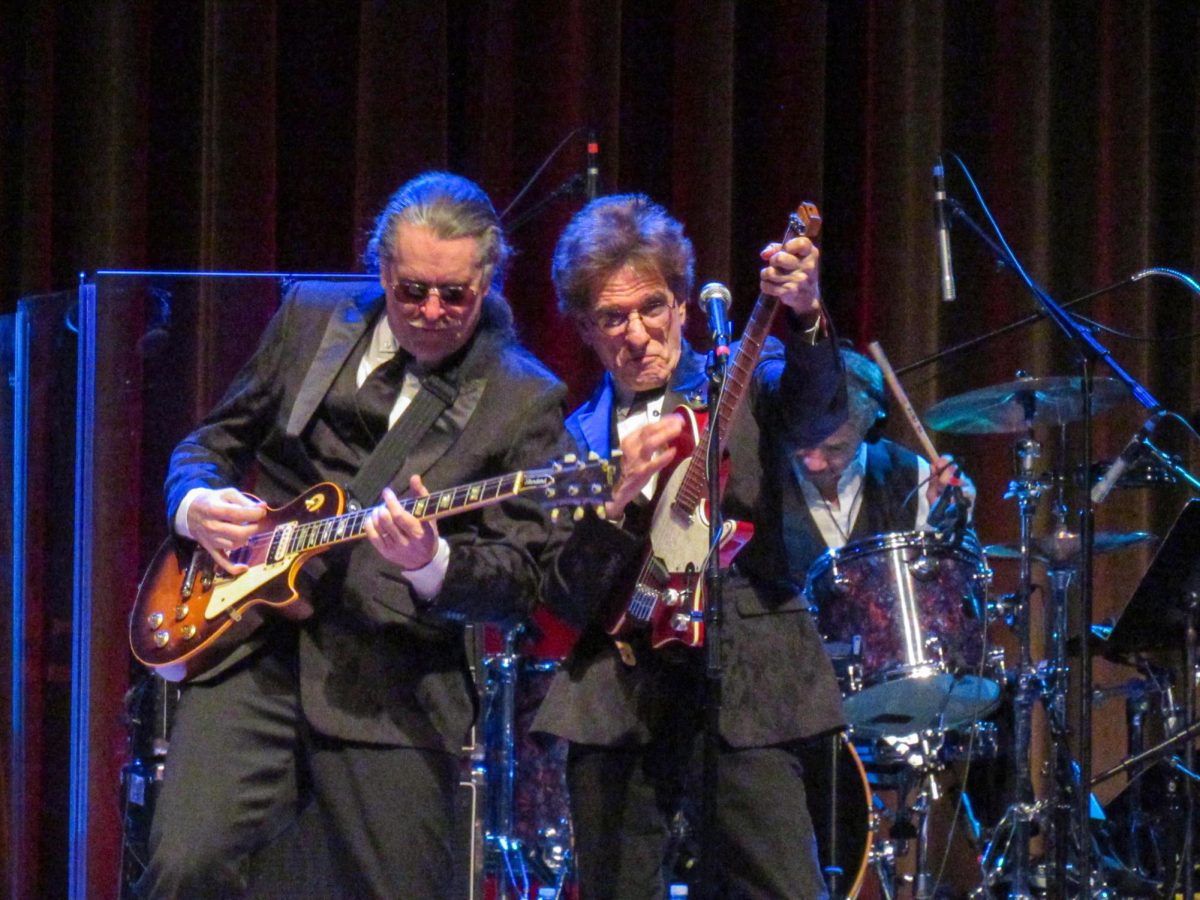 The Weeklings lead guitarist John Merjave [Left] and guitarist Bob Burger [Right] perform "I Am the Walrus" at The Weeklings Beatles Bash concert in the Dvorak Concert Hall on Saturday.