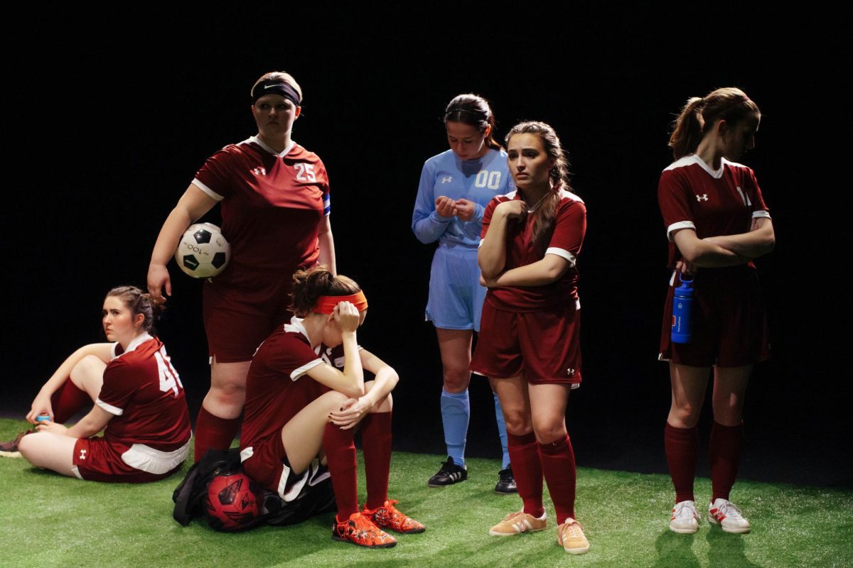 The team listens as its captain Patience Cox [Number 25] lectures to them about what's appropriate to talk about through practice during "The Wolves" on Thursday, March 6, in the Black Box Theatre in the Doudna Fine Arts Center in Charleston, Ill. 