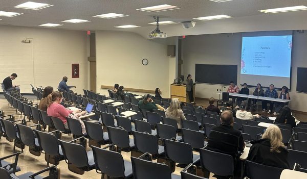 Students and faculty members gather to listen to students share experiences of living on campus as AAPI here in Coleman hall in the Lumpkin Auditorium Wednesday evening.