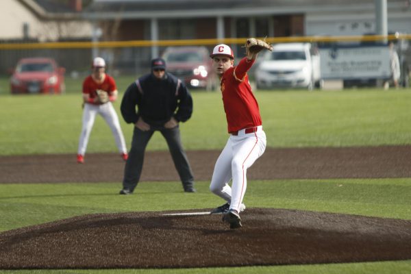 Charleston High School senior Luke Bonnstetter pitches during game one of the Trojans' doubleheader against Mattoon on Monday afternoon at Mattoon High School in Mattoon, Illinois