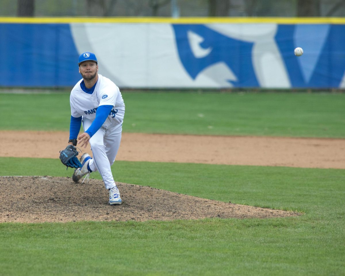 Eastern Illinois University baseball graduate student pitcher Tyler Kapraun delivering the pitch to home plate at Coaches Stadium during Eastern’s win against UT Martin 9-4 after the game got rained out in six innings on Friday.
