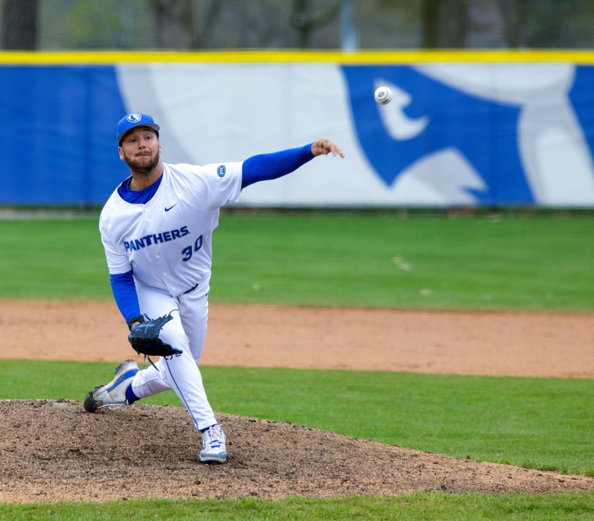 Eastern Illinois University baseball graduate student pitcher Tyler Kapraun delivering the pitch to home plate at Coaches Stadium during Eastern’s win against UT Martin 9-4 after the game got rained out in six innings on Friday.