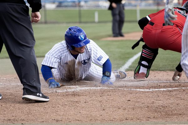 Number 18 infield senior Chris Worcester slides into home base during the Eastern Illinois University  panthers against the Saint Xavier cougars at Coaches Stadium on the Eastern Illinois University campus, Charleston Ill. EIU on 13-03 